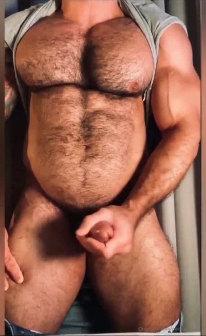 Muscle bear shows off hairy muscles and jacks off