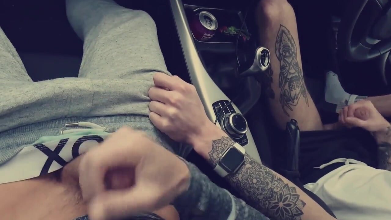 Two horny lads play and wank each other off in the car