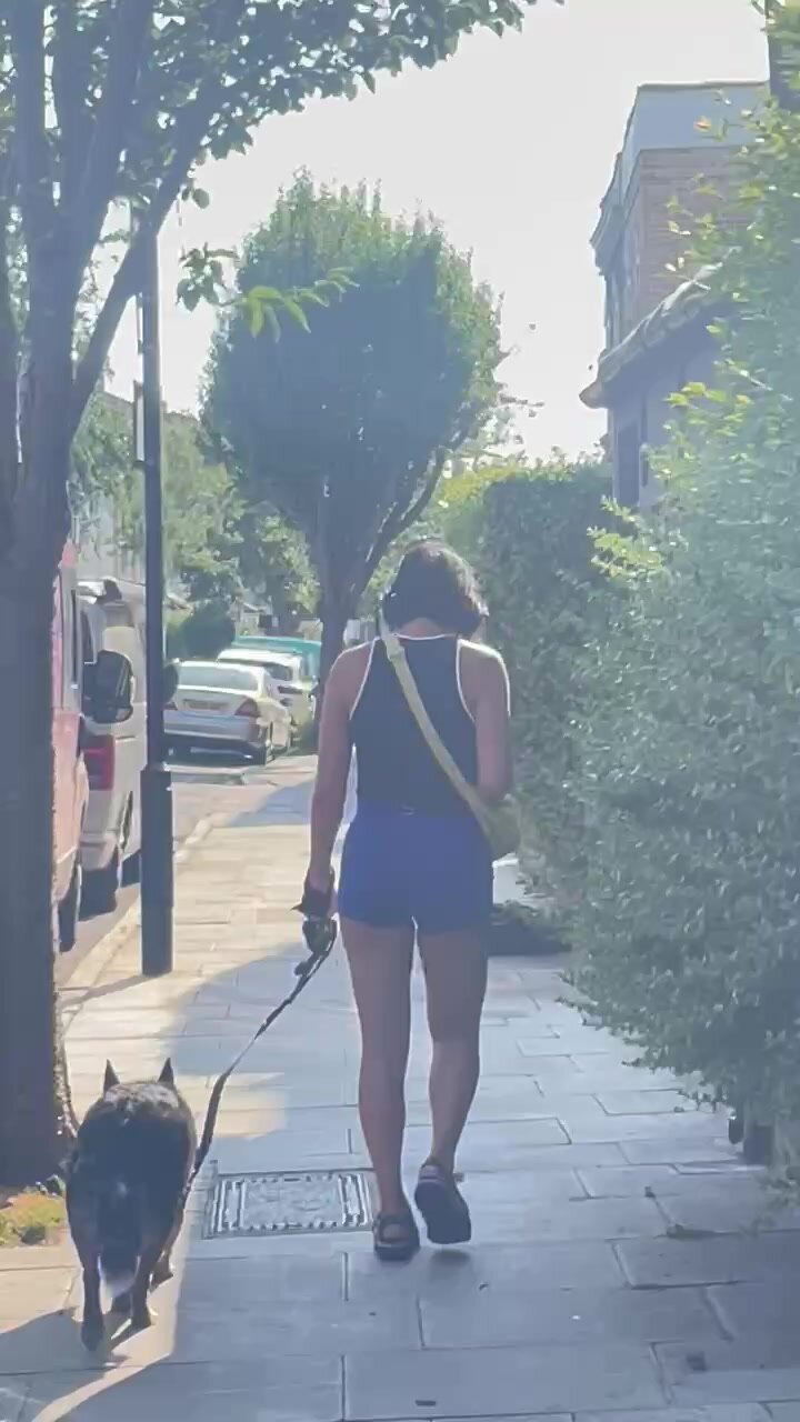 Skinny Asian girl walking the dog