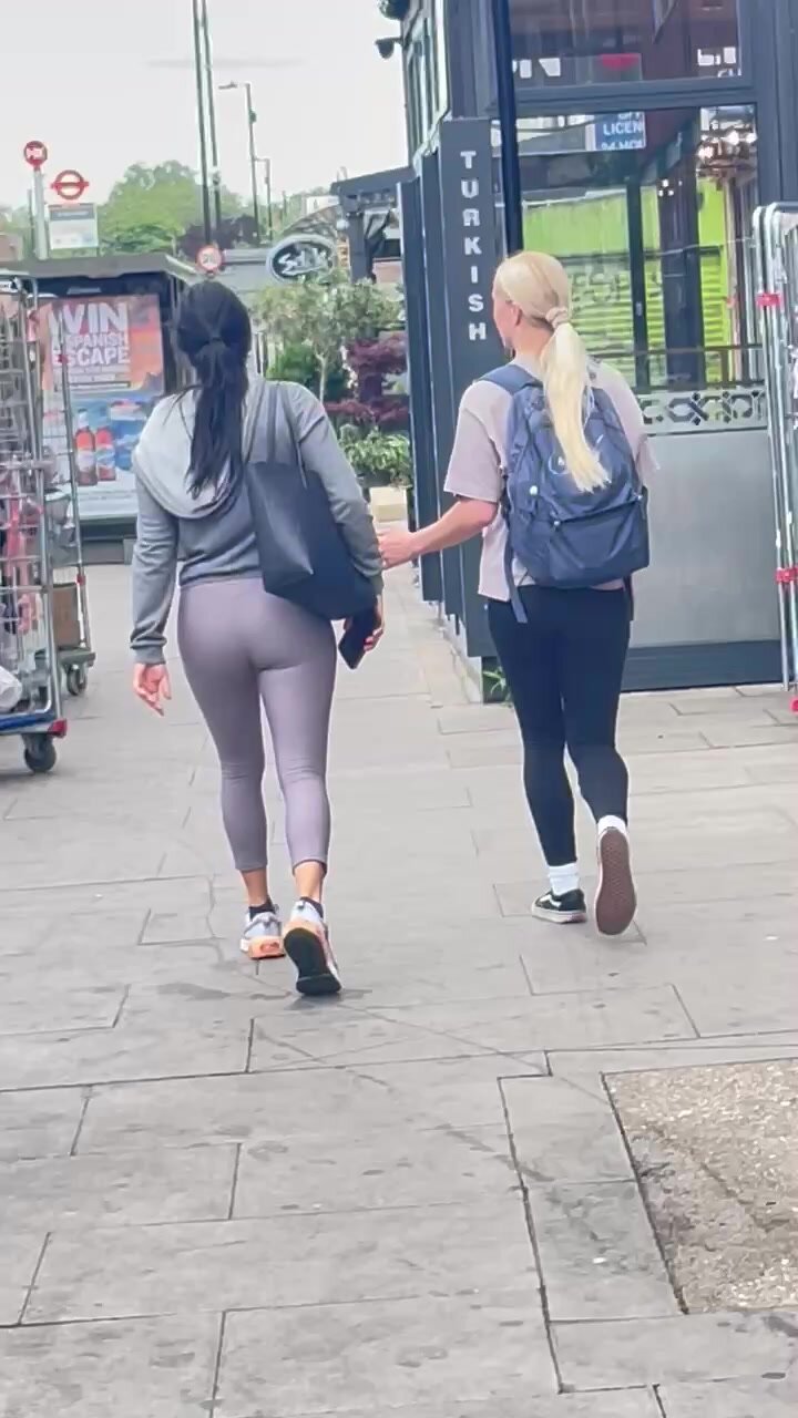 Brunette and blonde walking in leggings