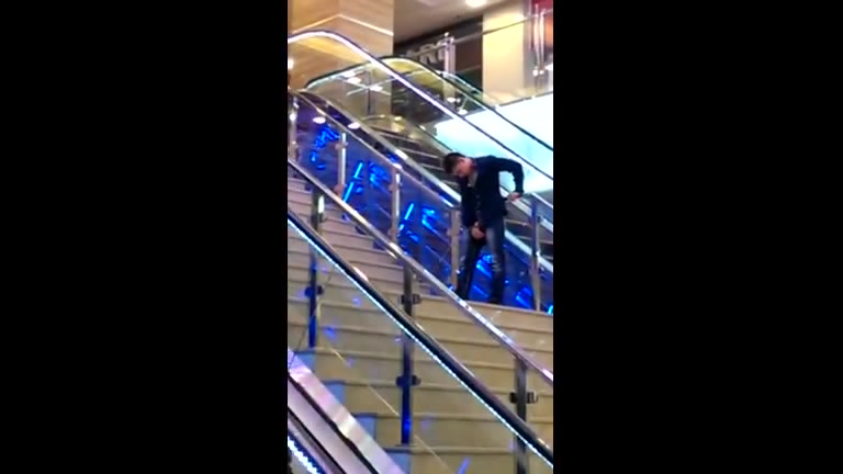 Wasted guy pissing in the mall
