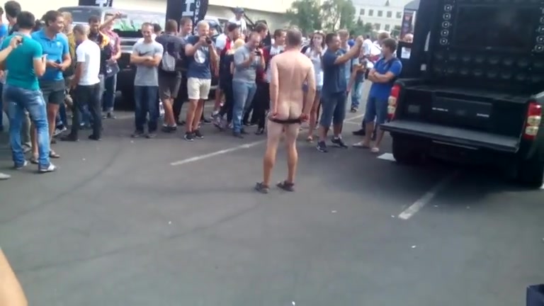 Guy dancing to the music naked