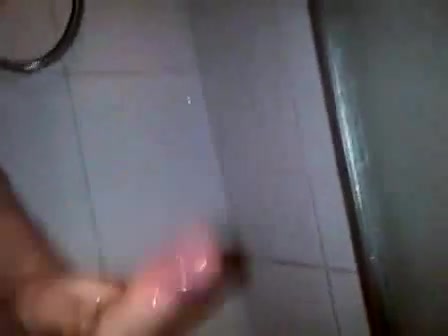 Stud jerks his massive cock in the shower