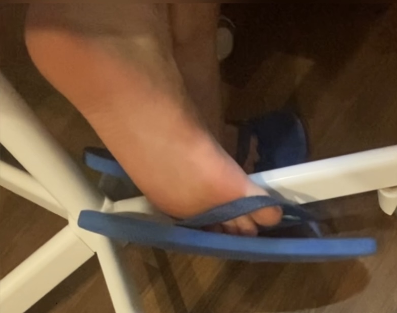 Boy flip flops shoeplay and candid feet while studying
