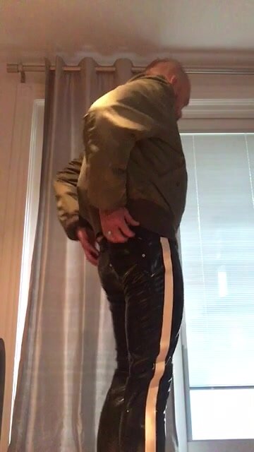 Skinhead in rubber pants