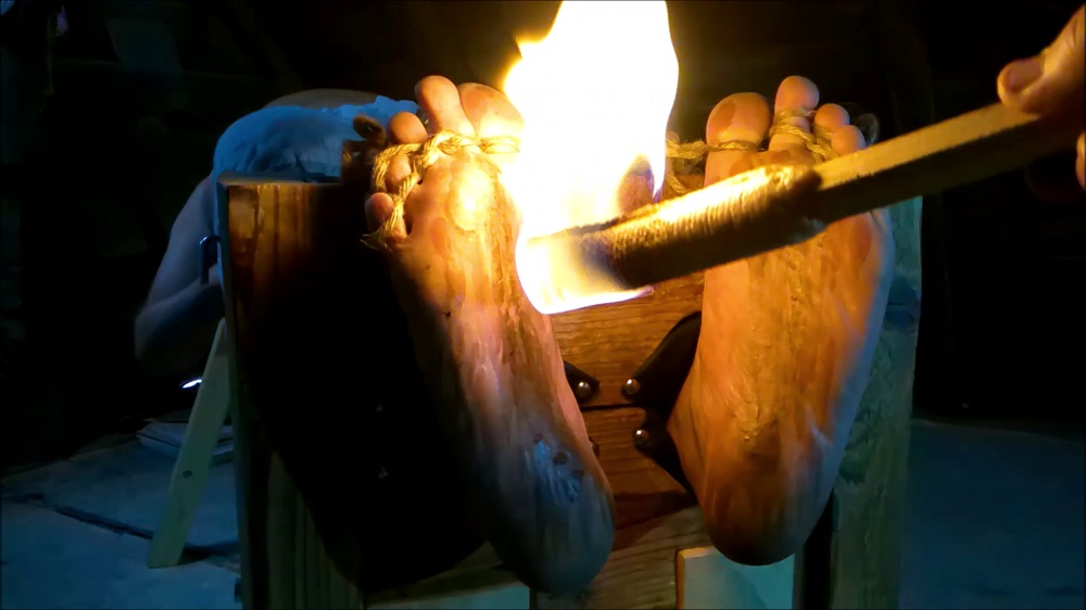 foot ... with a burning torch