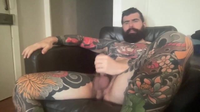 Hairy bulky tatted guy.  No cum