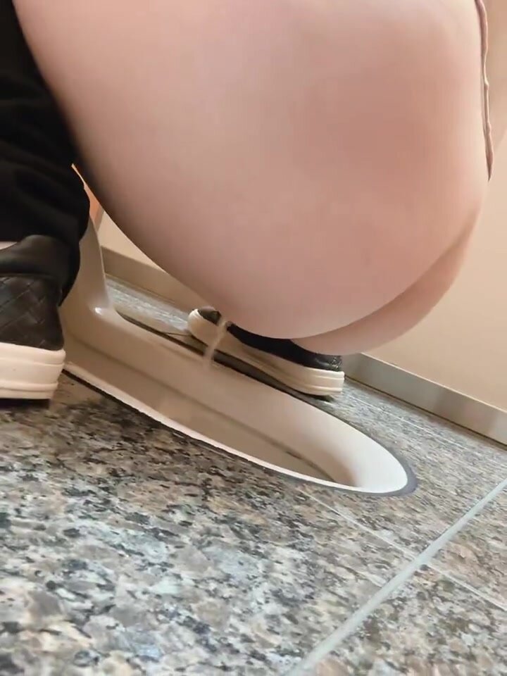 Voyeur gets right behind girls ass using squat toilet