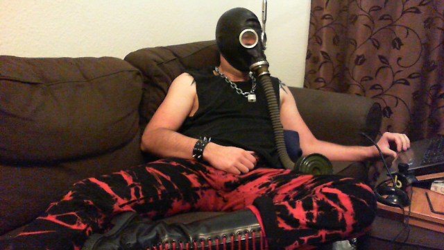 Punk with saline balls and poppers in gasmask cum