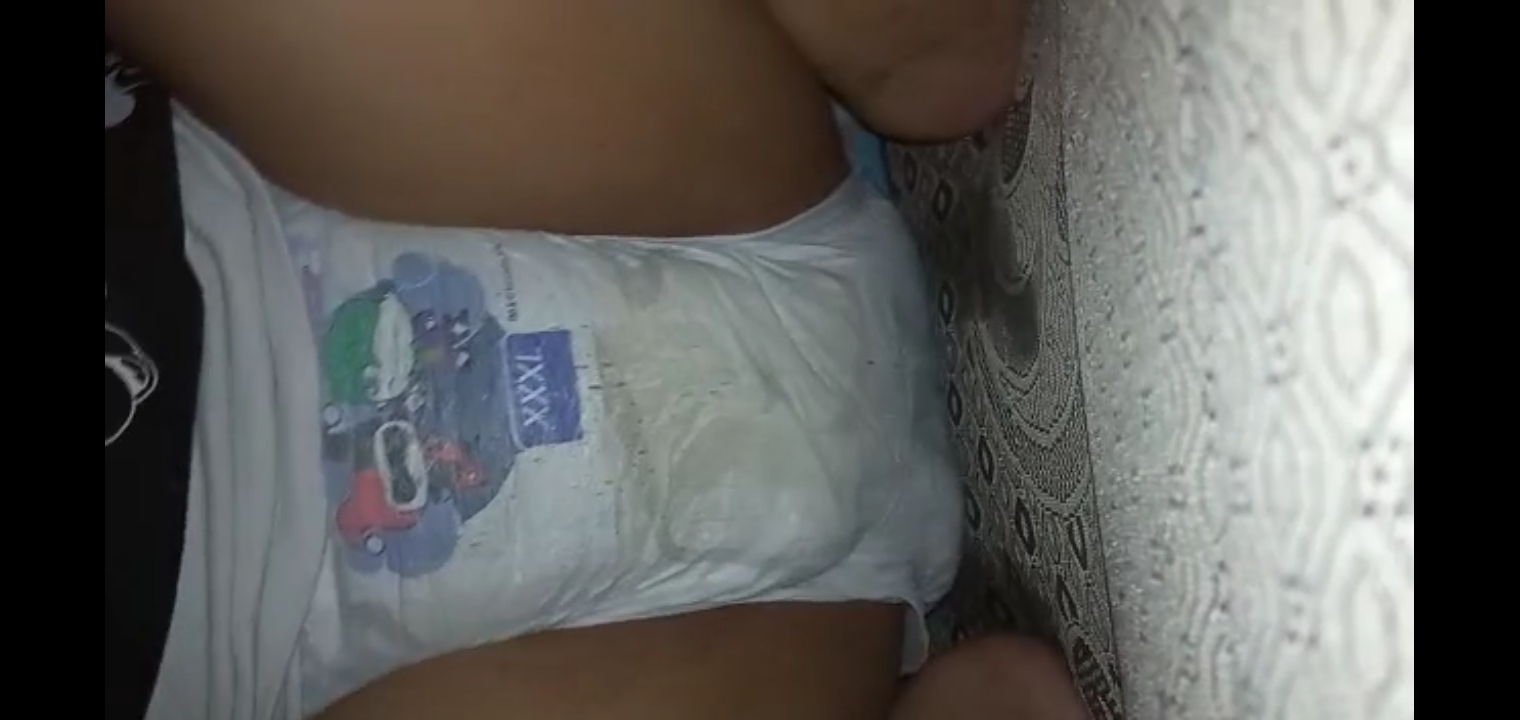 Asian teen girl wearing diaper