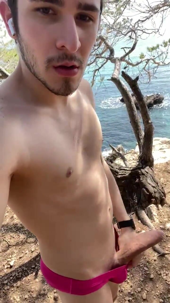 showing off big fat dick near the sea