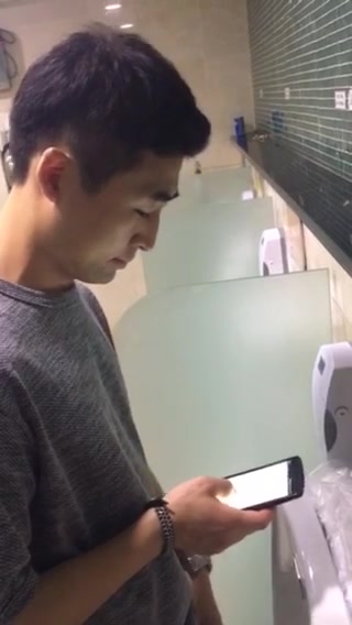 Asian boy peeing