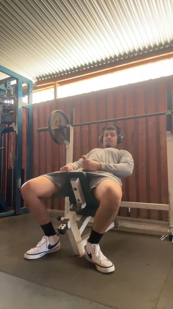 Sexy latino flashes hard cock while lifting weights