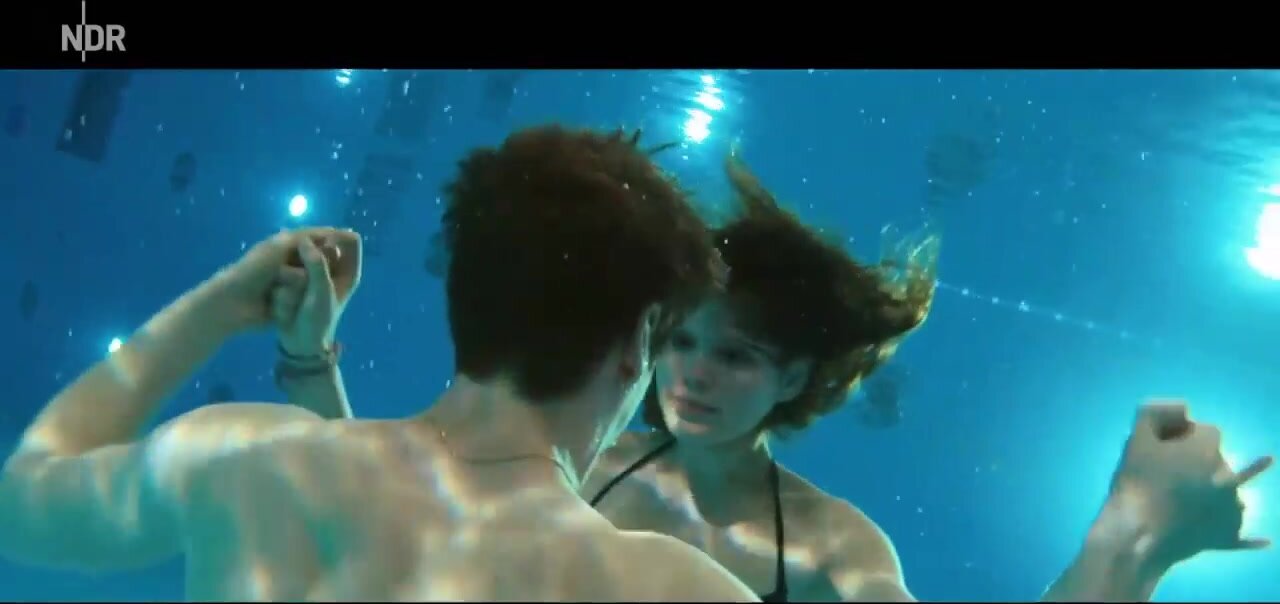 She keeps him underwater and gives him oxygen