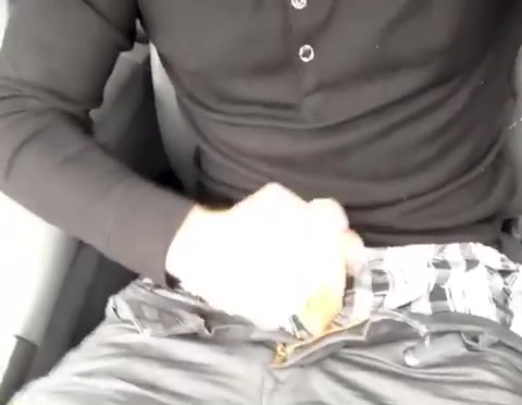 Guy talks as he jerks in his car