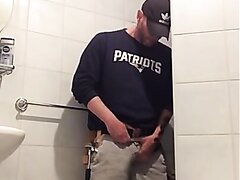 construction worker pisses himself in front of toilet