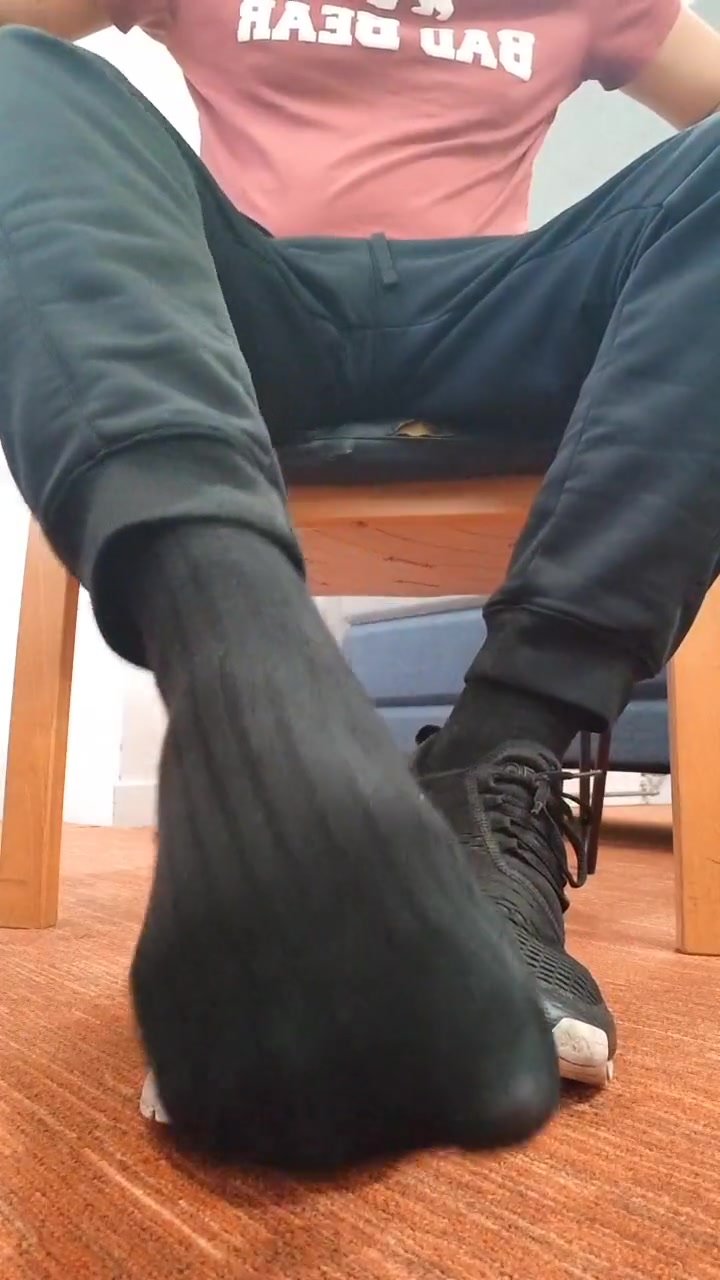 Master shows off his sweaty black socks