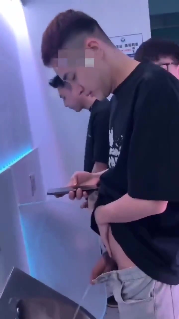 asian guy showing off big dick at the urinals