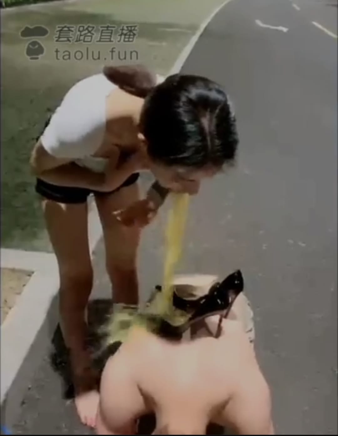 man being vomited in public