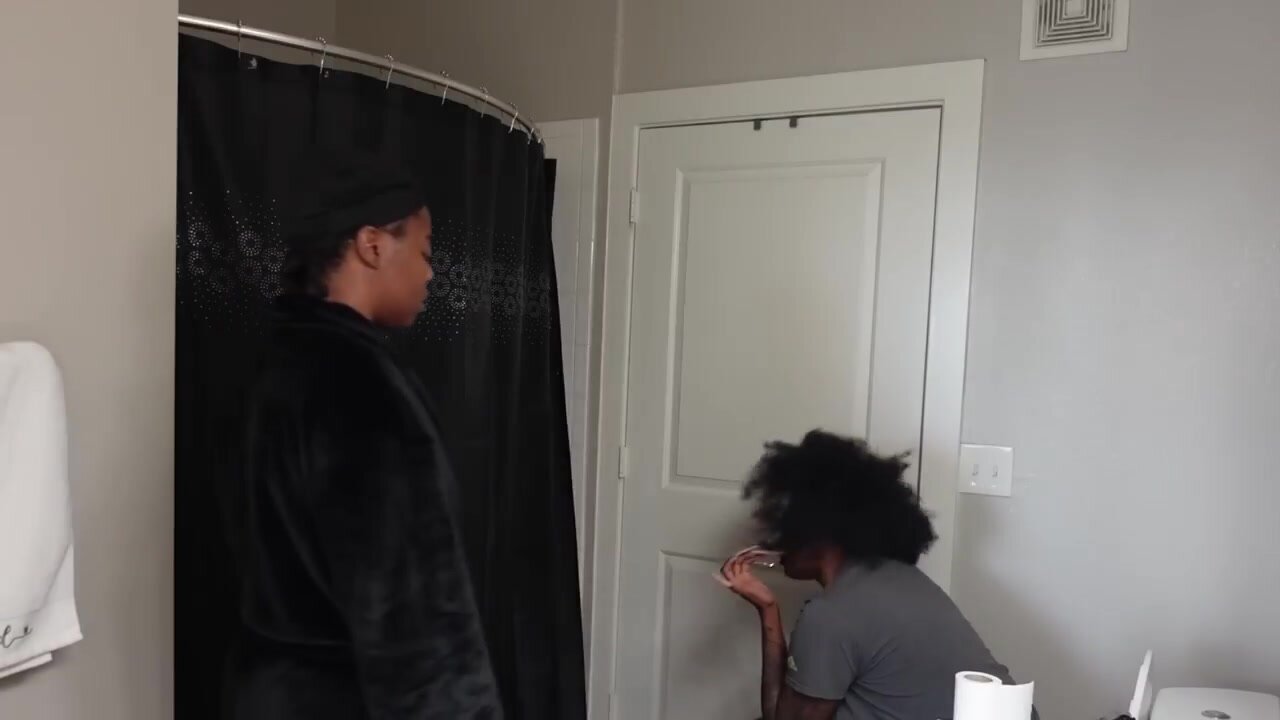 Female dumping water on her girlfriend while on toilet