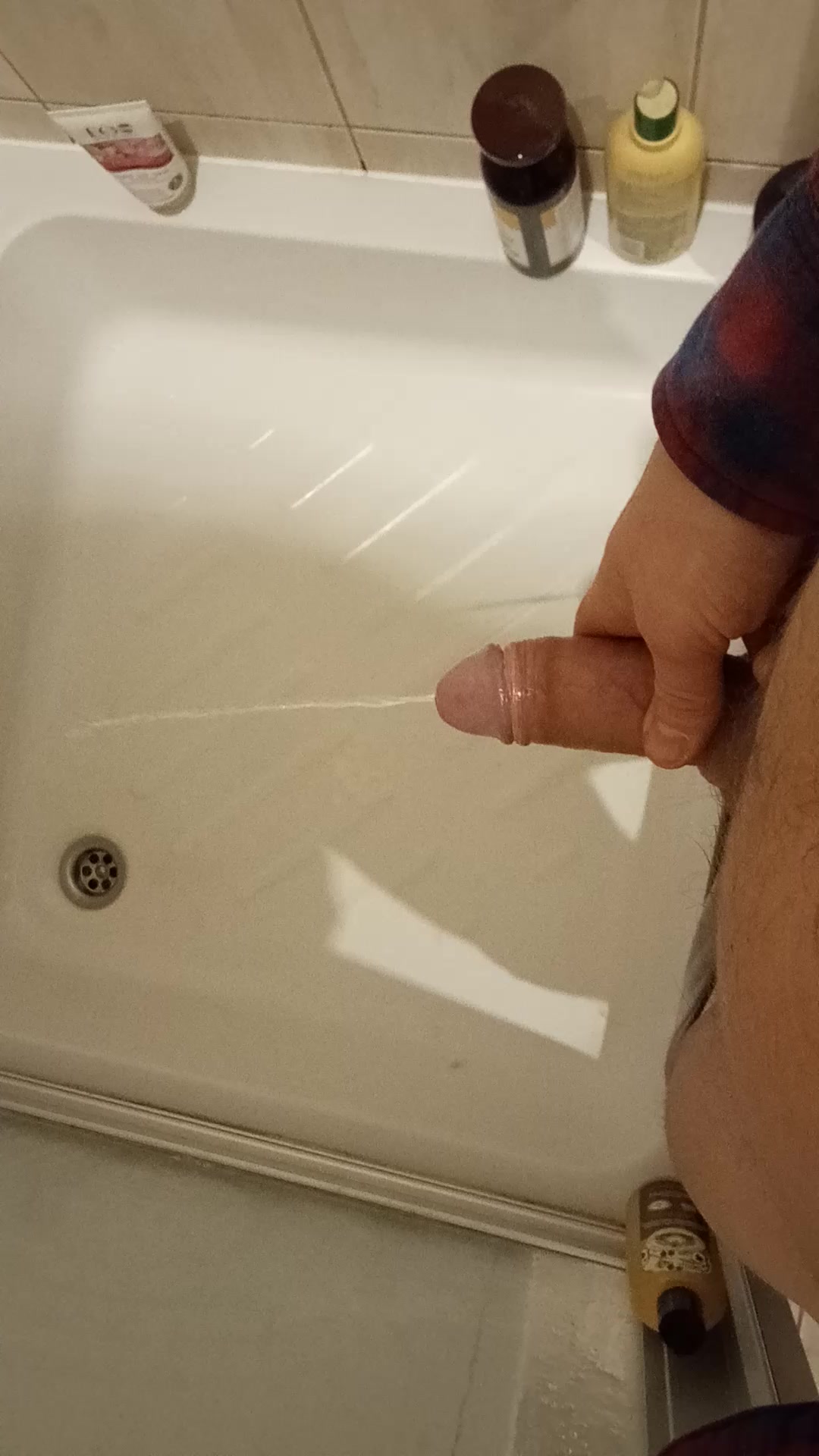 me pissing in the shower with hard on