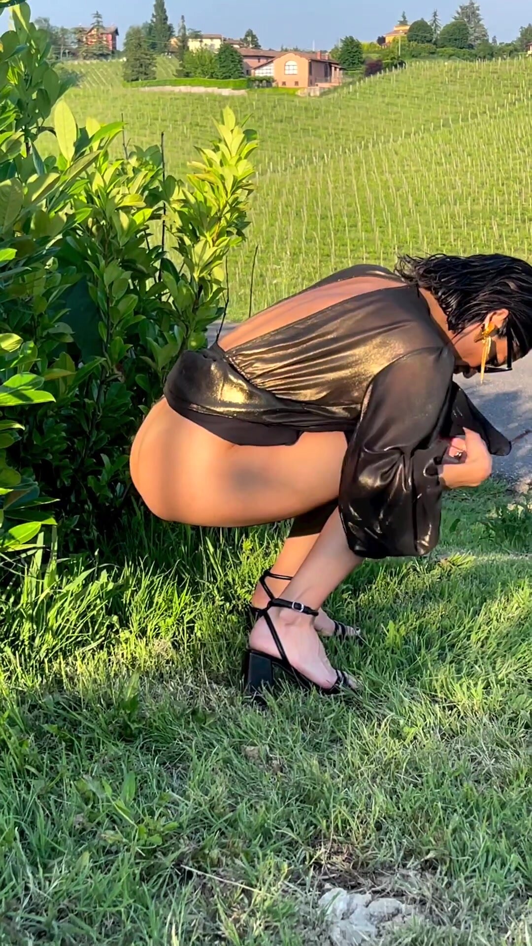 Beauty squats in a vineyard
