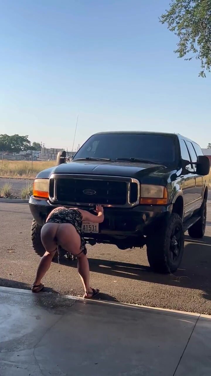 Anna pisses infront of 7" lifted truck leaving a puddIe