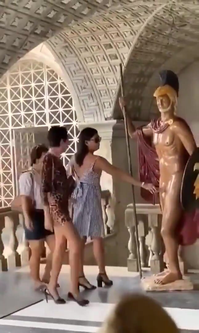 Ladies walk by naked male statue, gets horny