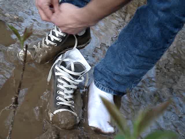 With Jeans and Converse in the Muddy River