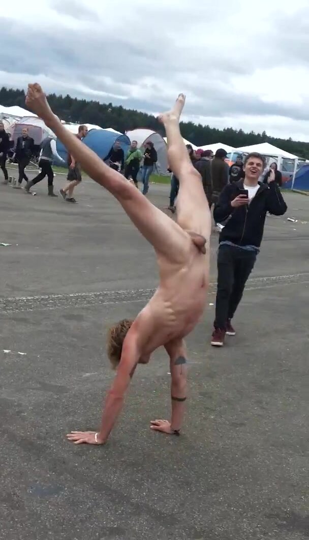 Drunk guy does naked handstand at festival (frontal)