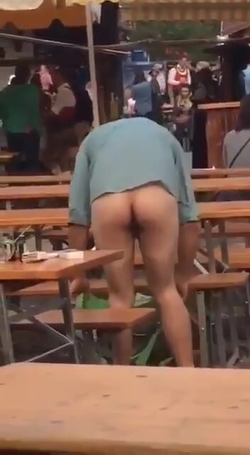 Drunk guy changes into mankini in public (side frontal)