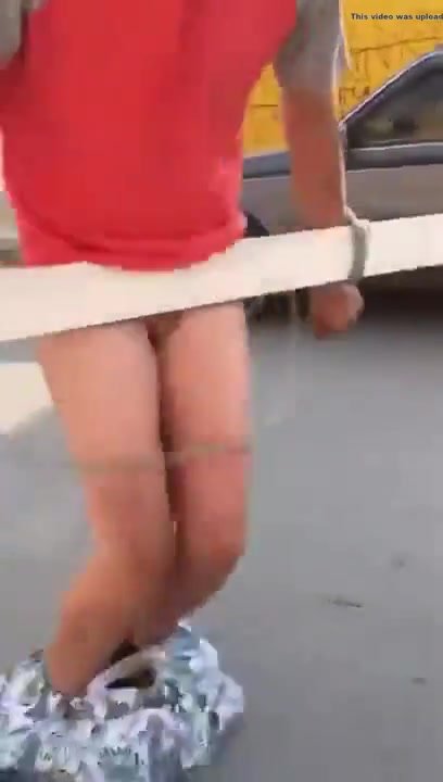 Arms tied to wood pantsing prank (frontal)