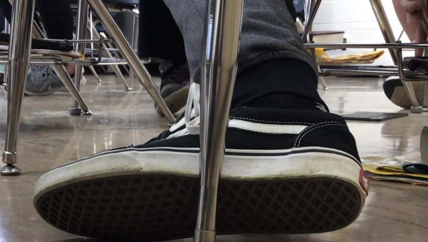 Teen Boy Vans Shoeplay in Class
