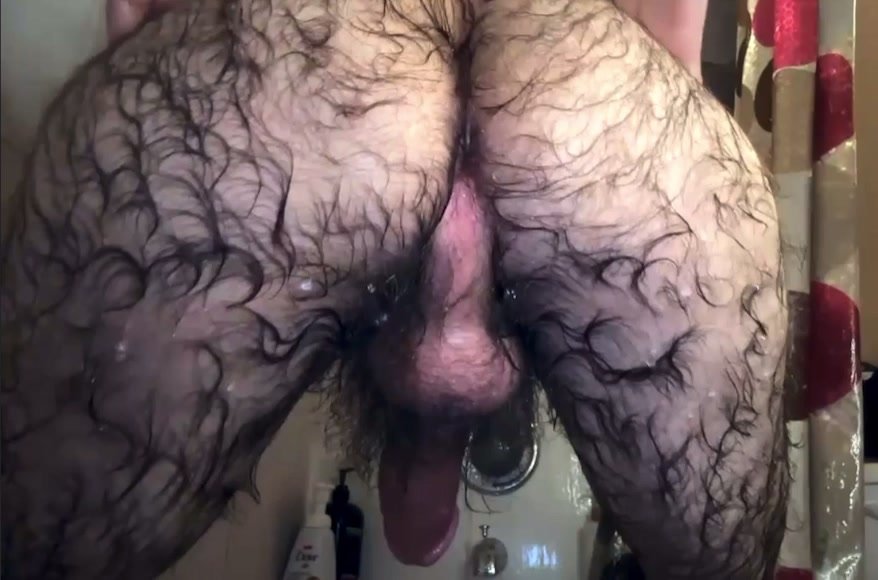 Very hairy stud taking shower