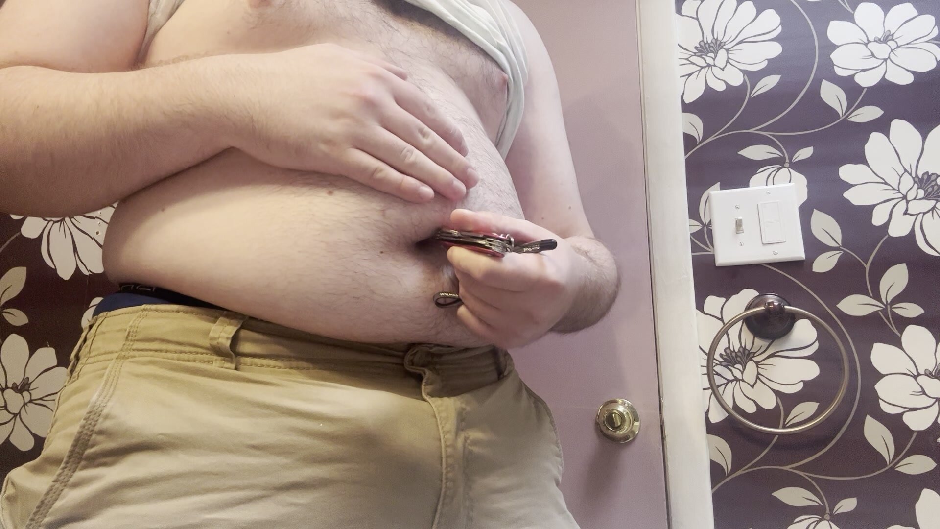 Fat gay guy stabs his belly button