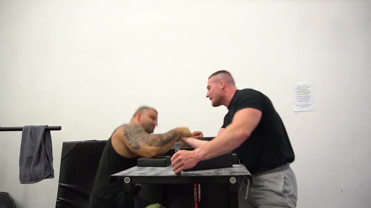 Huge strong and powerful stallions arm wrestling