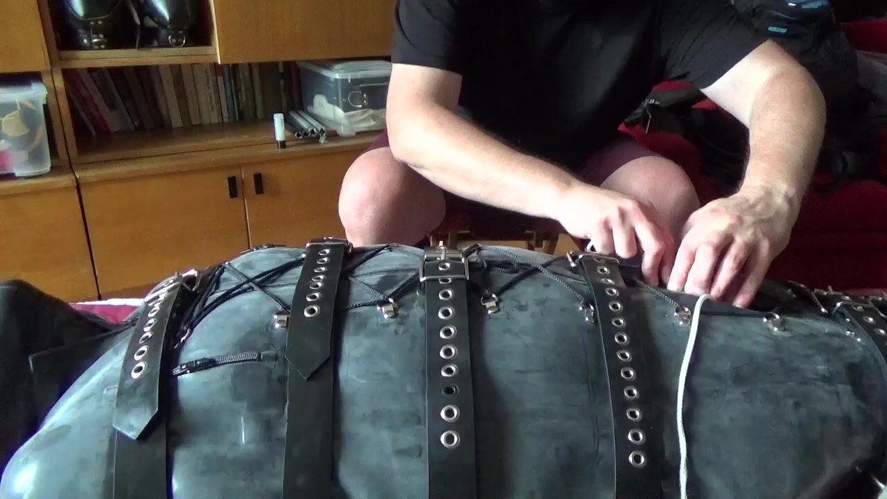 Slave is enjoyed  in a rubber bodybag - video 2