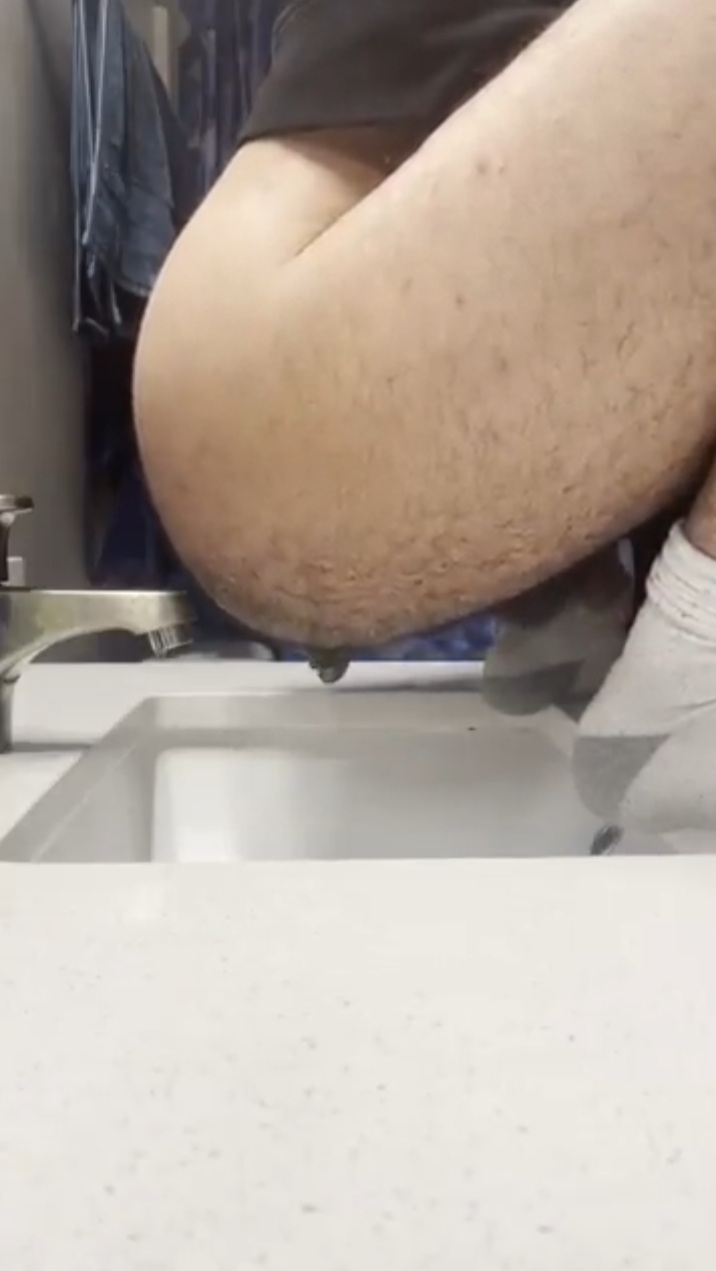 Shitting out a huge log in the sink