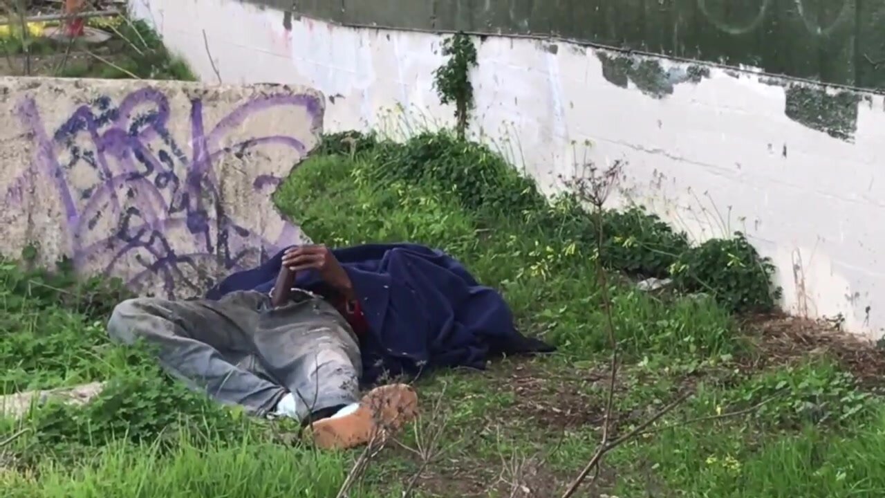 Homeless guy masturbates under the blanket