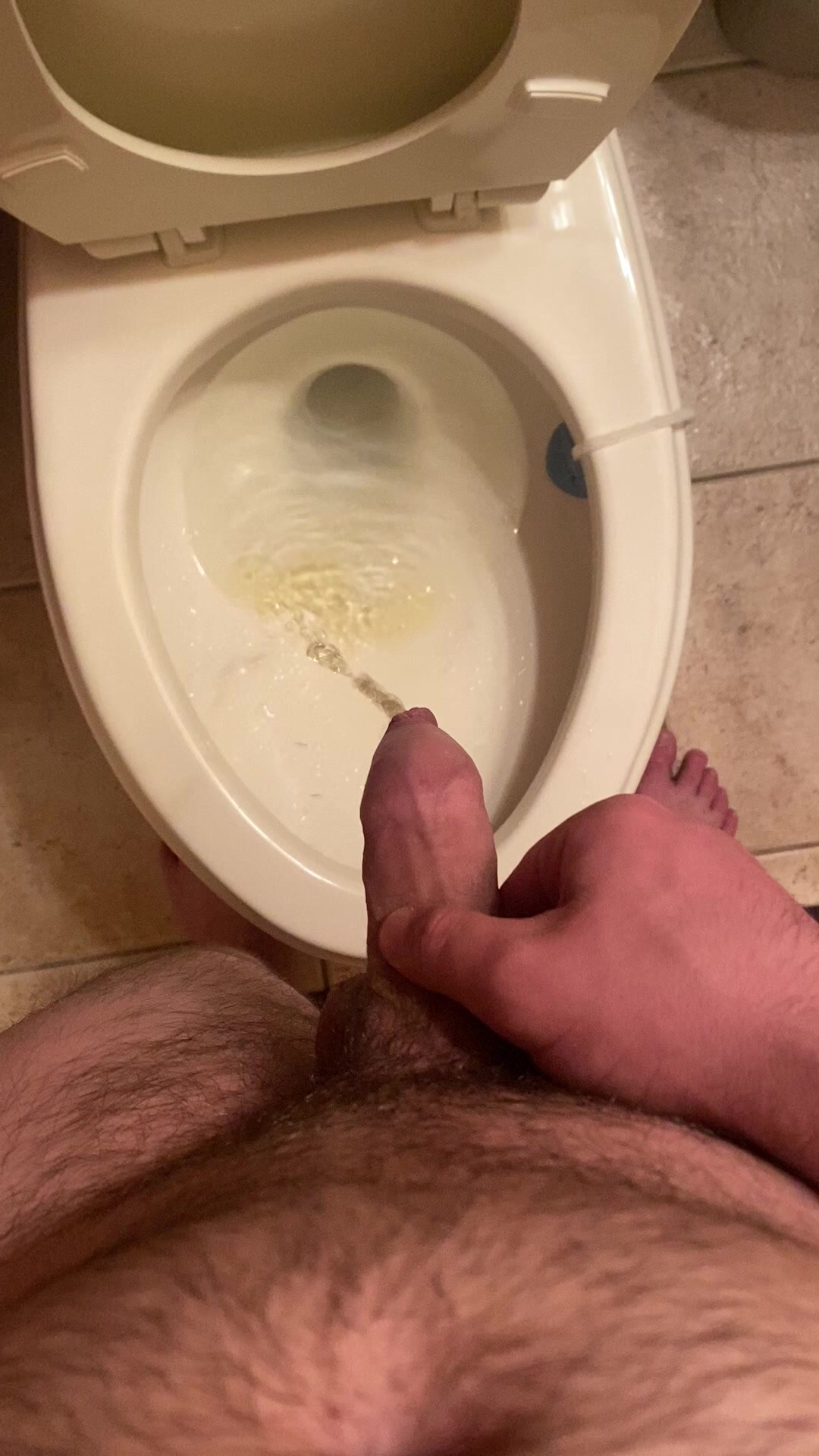 Long piss from uncut dick