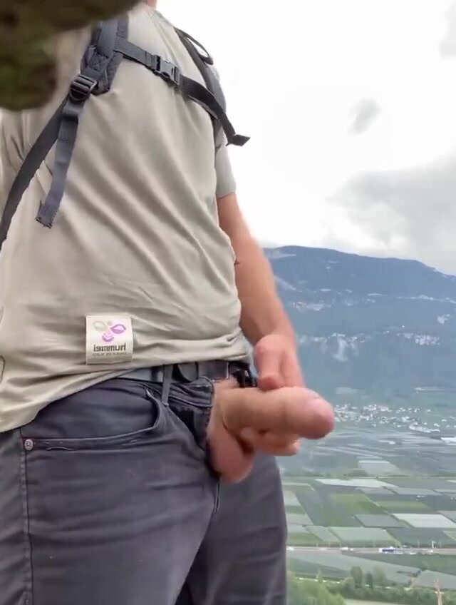 Horny guy jerking his cock in the open air