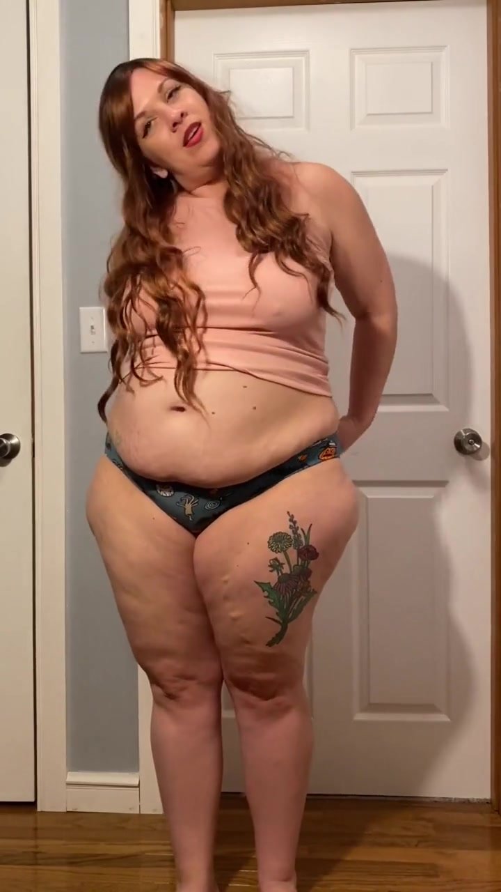 mature chubby girl measuring her fat body