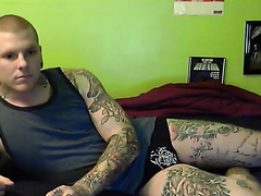 Heavily tattooed beefy guy