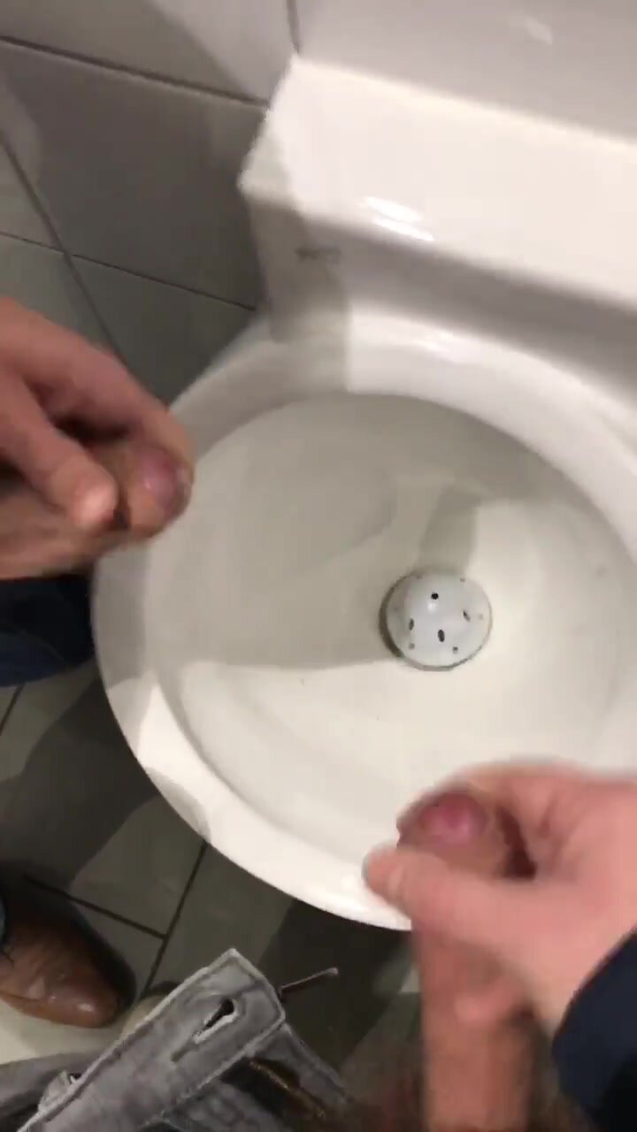 Two jerk into one urinal