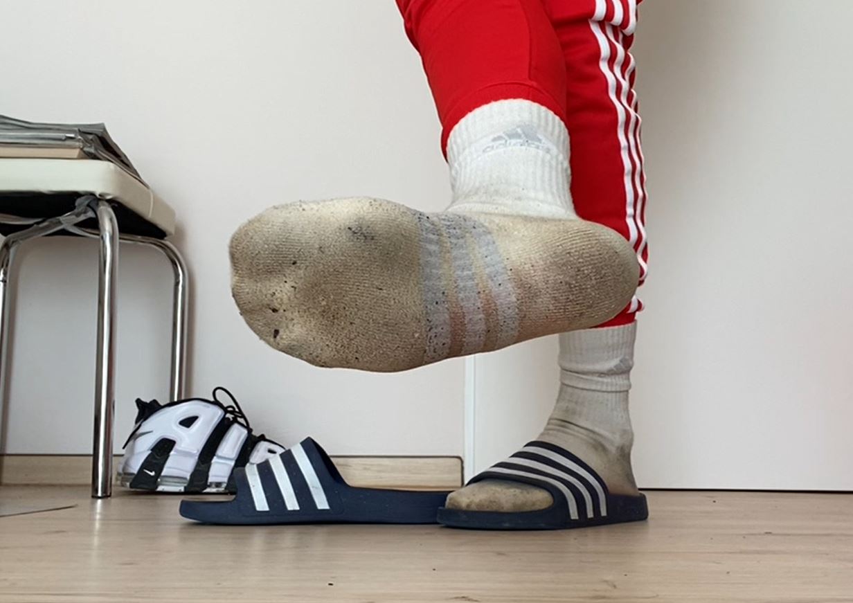 Adidas sliders and dirty white socks