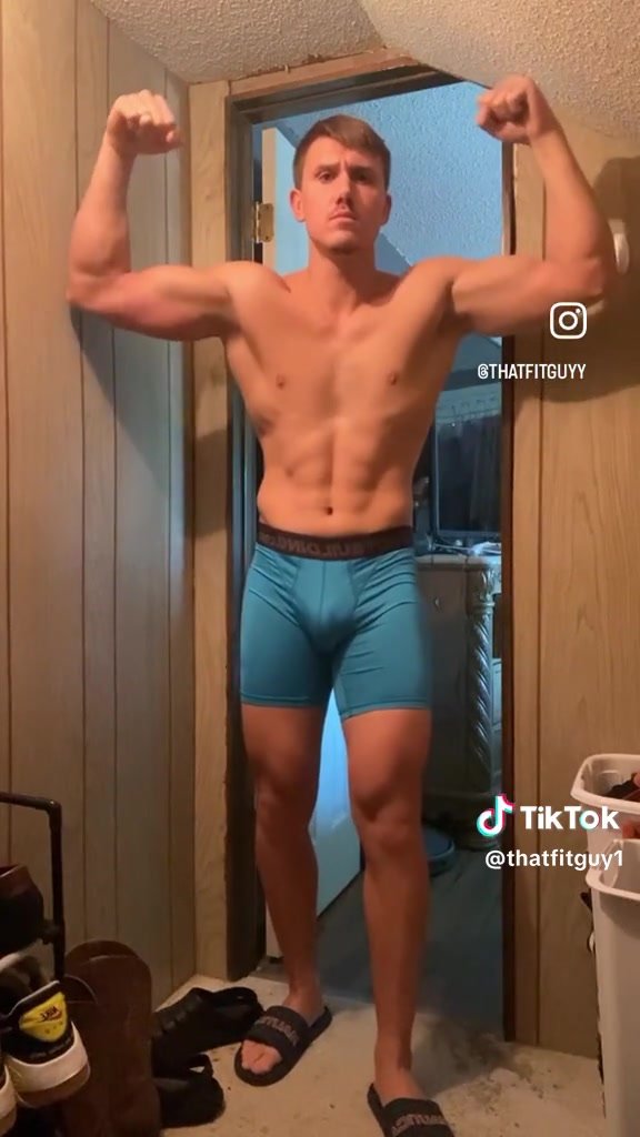 showing off his bulge in light blue boxerbriefs