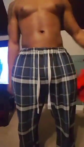 athletic jock pulls down PJ's and shows fat ass