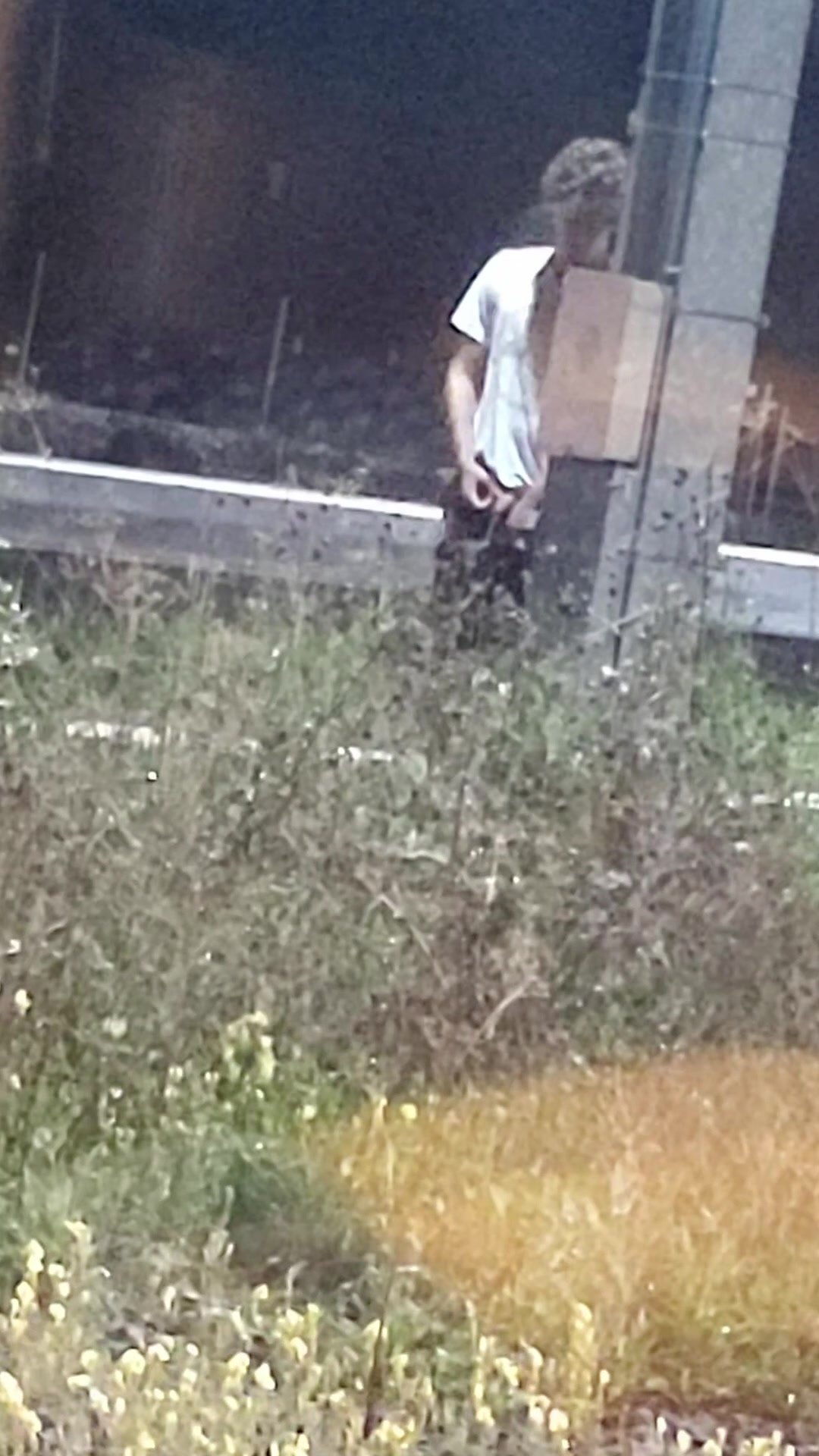 Spy guy pissing between train platforms