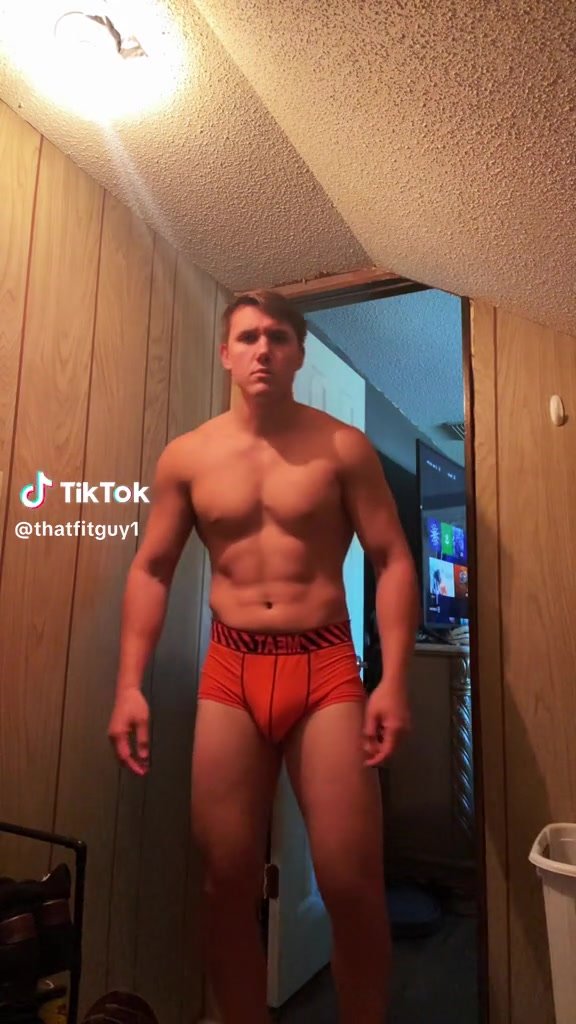 showing off his bulge in orange Meat boxebriefs