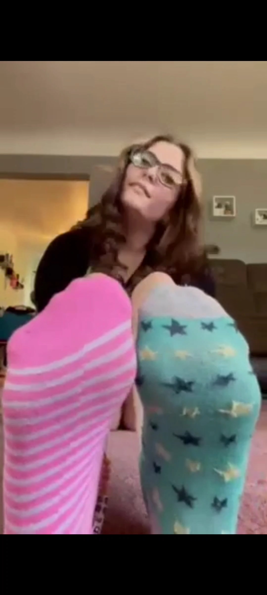 Girl shows off her colorful socks for your pleasure.